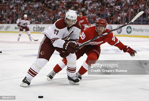 Radim Vrbata of the Phoenix Coyotes tries to control the puck in front of Niklas Kronwall of the Detroit Red Wings during Game Six of the Western...