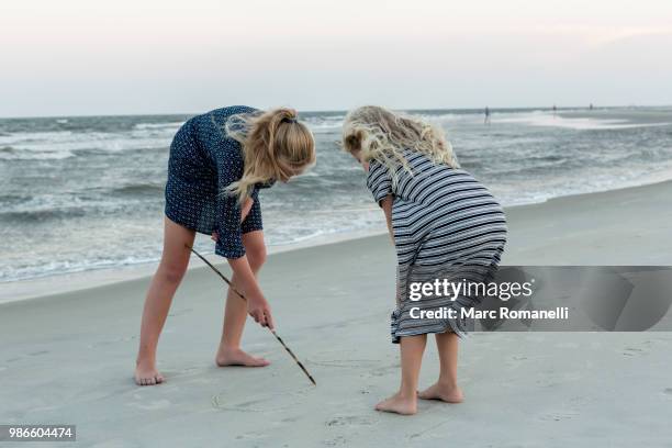 children playing at the beach - marc romanelli stock pictures, royalty-free photos & images