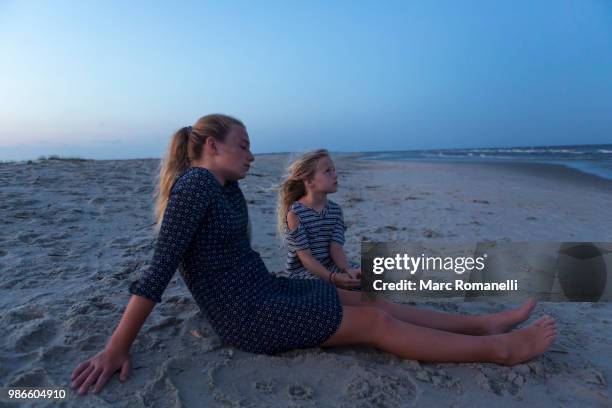 children playing at the beach - marc romanelli stock pictures, royalty-free photos & images