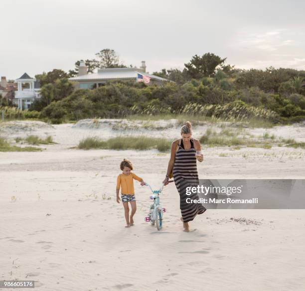 family walking to the beach - marc romanelli stock pictures, royalty-free photos & images