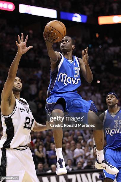 Guard Rodrigue Beaubois of the Dallas Mavericks takes a shot against Tim Duncan of the San Antonio Spurs in Game Three of the Western Conference...