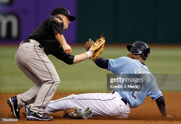 Infielder Aaron Hill of the Toronto Blue Jays tags out B.J. Upton of the Tampa Bay Rays on a steal attempt during the game at Tropicana Field on...