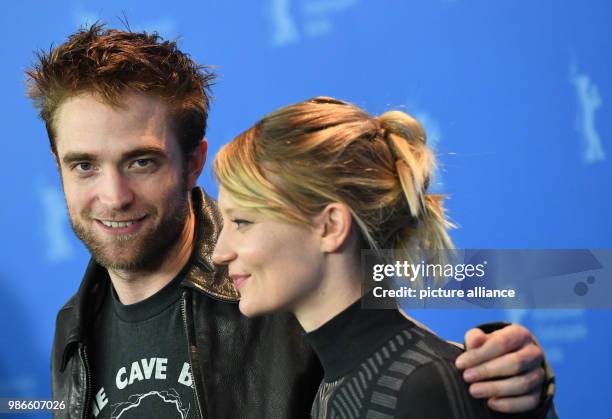 February 2018, Germany, Berlin: Berlinale 2018, photocall, 'Damsel': British actor Robert Pattinson and Australian actress Mia Wasikowska. The film...