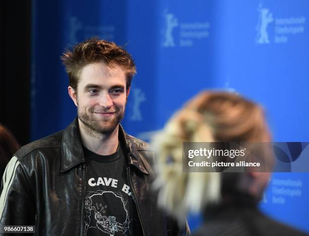 February 2018, Germany, Berlin: Berlinale 2018, photocall, 'Damsel': British actor Robert Pattinson and Australian actress Mia Wasikowska. The film...