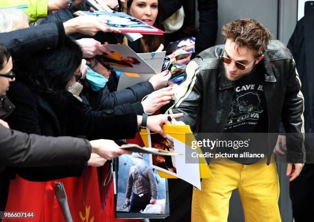 February 2018, Germany, Berlin: Berlinale 2018, arrival, 'Damsel': British actor Robert Pattinson with fans. The film runs in competition at the 68th...