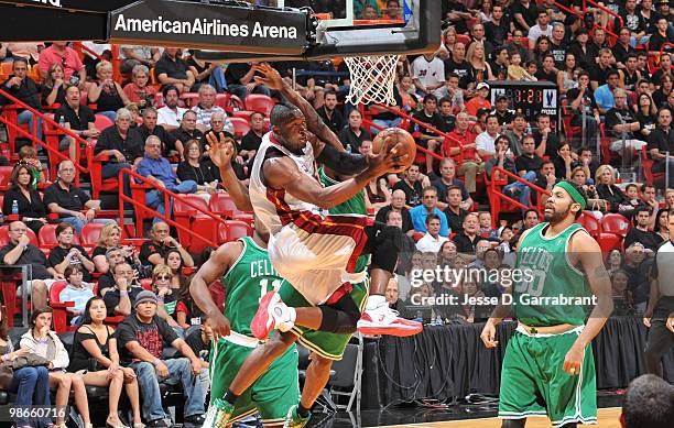 Dwyane Wade of the Miami Heat shoots against Rasheed Wallace of the Boston Celtics in Game Four of the Eastern Conference Quarterfinals during the...