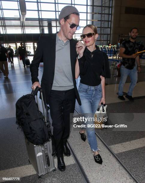 Michael Polish and Kate Bosworth are seen at LAX on June 28, 2018 in Los Angeles, California.