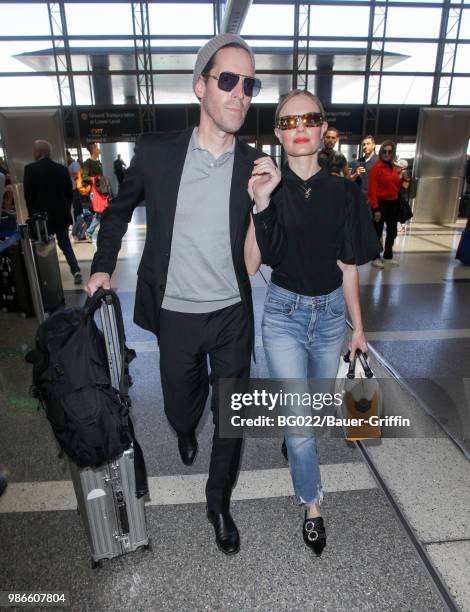 Michael Polish and Kate Bosworth are seen at LAX on June 28, 2018 in Los Angeles, California.