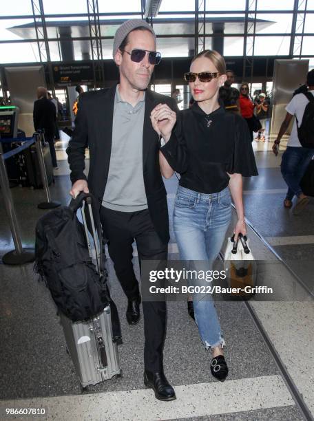 Michael Polish and Kate Bosworth are seen at LAX on June 28, 2018 in Los Angeles, California.