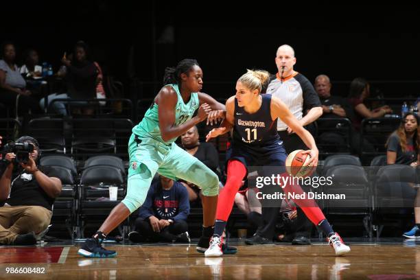 Elena Delle Donne of the Washington Mystics handles the ball against Tina Charles of the New York Liberty on June 28, 2018 at Capital One Arena in...