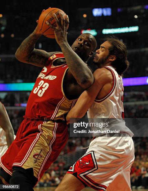 Shaquille O'Neal of the Cleveland Cavaliers moves to the basket against Joakim Noah of the Chicago Bulls in Game Four of the Eastern Conference...