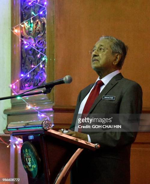 This picture taken on June 28, 2018 shows Malaysian Prime Minister Mahathir Mohamad delivers his address to Malaysian citizens at the Malaysian...