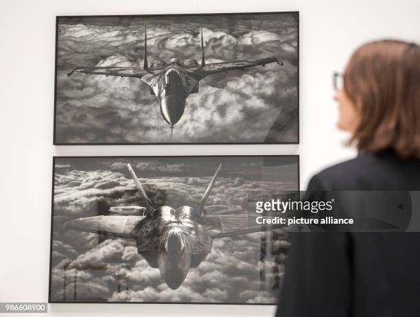 February 2018, Germany, Hamburg: A visitor looks at the exhibited art works 'Untitled ' and 'Untitled ' of artist Robert Long during press tour of...