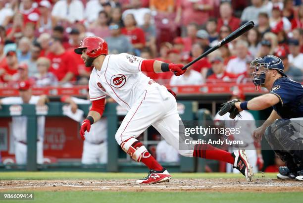 Jose Peraza of the Cincinnati Reds hits a single in the second inning against the Milwaukee Brewers at Great American Ball Park on June 28, 2018 in...