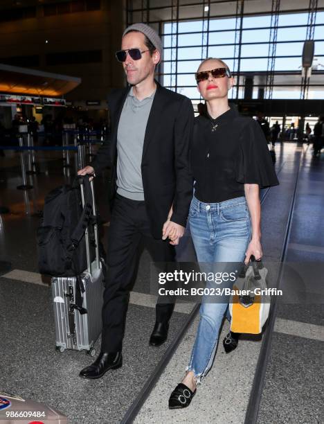 Michael Polish and Kate Bosworth are seen at LAX on June 28, 2018 in Los Angeles, California.