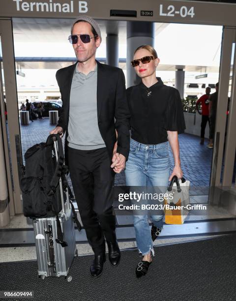 Michael Polish and Kate Bosworth are seen at LAX on June 28, 2018 in Los Angeles, California.