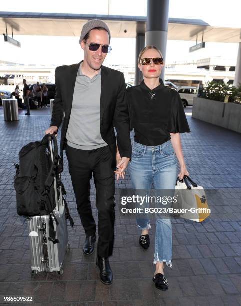 Michael Polish and Kate Bosworth are seen at LAX on June 28, 2018 in Los Angeles, California.