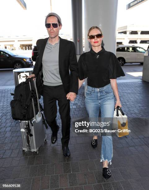 Michael Polish and Kate Bosworth are seen at LAX on June 28, 2018 in Los Angeles, California.