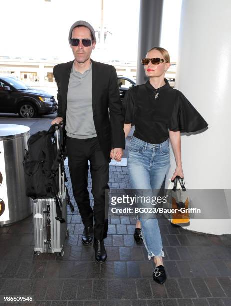 Michael Polish and Kate Bosworth are seen at LAX on June 28, 2018 in Los Angeles, California.