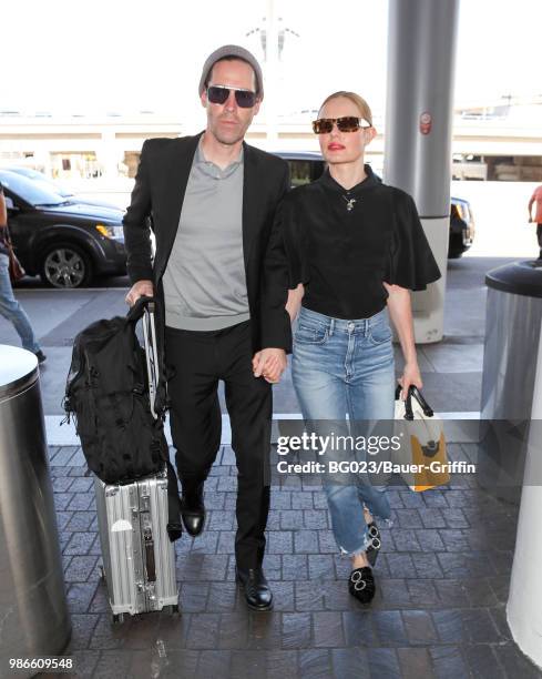 Michael Polish and Kate Bosworth are seen at LAX on June 28, 2018 in Los Angeles, California.