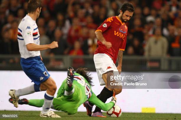 Mirko Vucinic of AS Roma with Marco Storari the goalkeeper of UC Sampdoria compete for the ball during the Serie A match between AS Roma and UC...