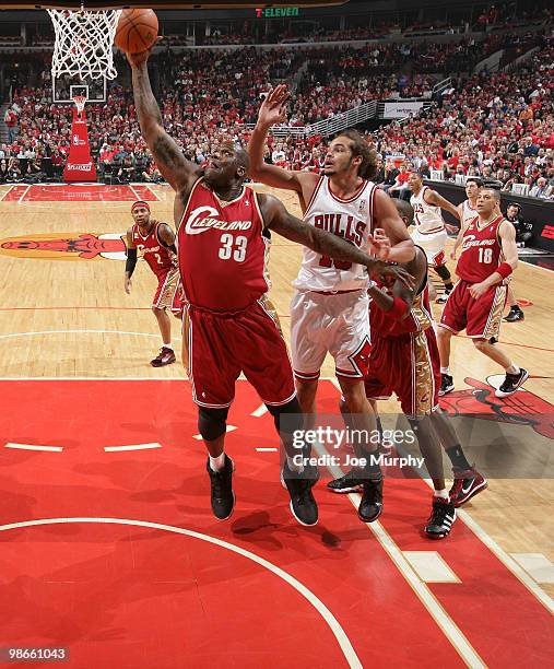 Shaquille O'Neal of the Cleveland Cavaliers grabs a rebound from Joakim Noah of the Chicago Bulls in Game Four of the Eastern Conference...