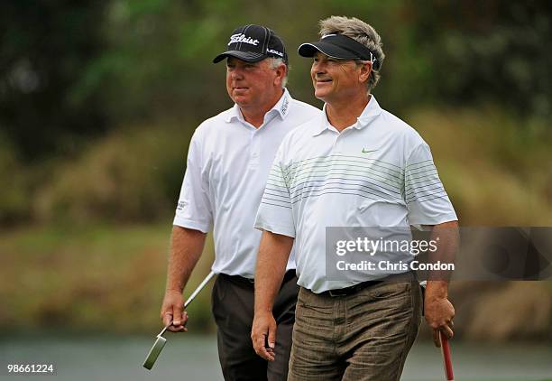 Mark O'Meara and John Cook walk up the 17th hole during the final round of the Legends Division at the Liberty Mutual Legends of Golf at The Westin...