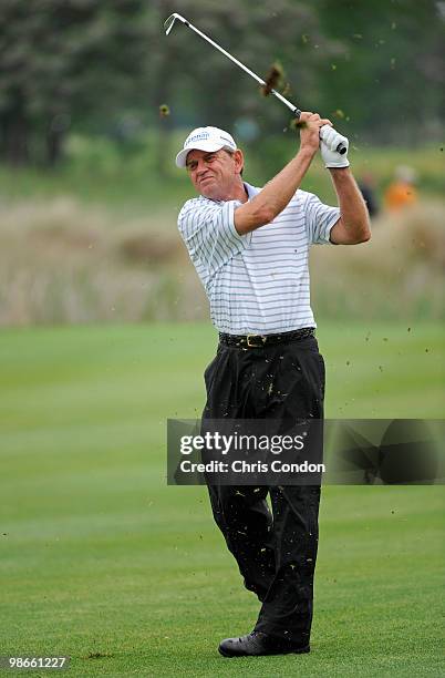 Nick Price of Zimbabwe hits his approach on during the final round of the Legends Division at the Liberty Mutual Legends of Golf at The Westin...