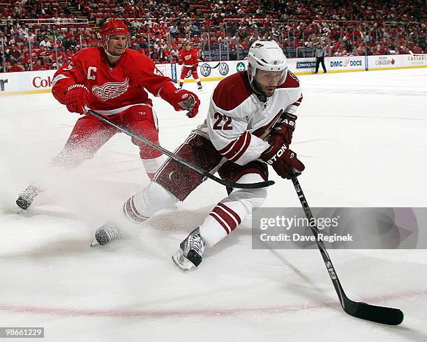 Lee Stempniak of the Phoenix Coyotes tries to keep control of the puck away from Nicklas Lidstrom of the Detroit Red Wings during Game Six of the...