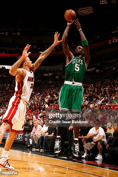 Kevin Garnett of the Boston Celtics shoots against Michael Beasley of the Miami Heat in Game Four of the Eastern Conference Quarterfinals during the...