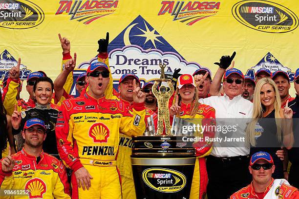Kevin Harvick, driver of the Shell/Pennzoil Chevrolet, poses in Victory Lane after winning the NASCAR Sprint Cup Series Aaron's 499 at Talladega...
