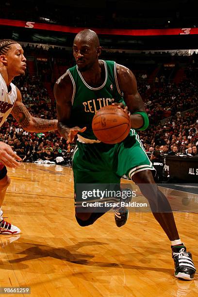 Kevin Garnett of the Boston Celtics drives against Michael Beasley of the Miami Heat in Game Four of the Eastern Conference Quarterfinals during the...