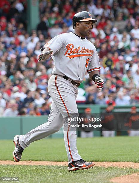 Miguel Tejada of the Baltimore Orioles rounds the bases after he hit a home round against the Boston Red Sox at Fenway Park on April 25, 2010 in...