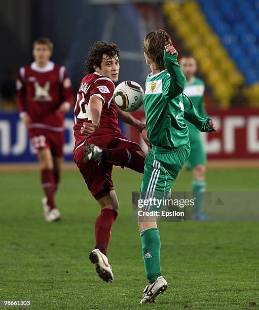 Alan Kasaev of FC Rubin Kazan battles for the ball with Mahir Shukurov of FC Anzhi Makhachkala during the Russian Football League Championship match...