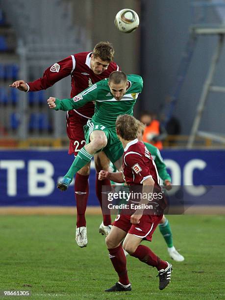 Aleksandr Orekhov of FC Rubin Kazan battles for the ball with Goland Jan of FC Anzhi Makhachkala during the Russian Football League Championship...