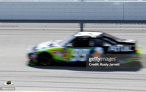Carl Edwards drives the Aflac Ford past a hat that had been thrown on track during the NASCAR Sprint Cup Series Aaron's 499 at Talladega...