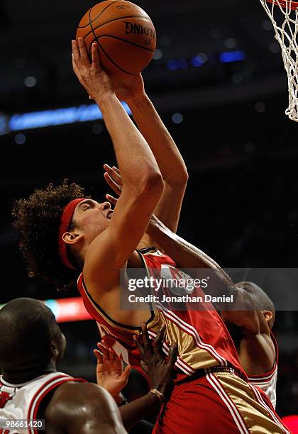 Anderson Varejao of the Cleveland Cavaliers is fouled while shooting by Taj Gibson of the Chicago Bulls in Game Four of the Eastern Conference...