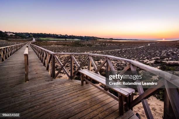 quinta do lago, wodden bridge sunrise. - quinta stock pictures, royalty-free photos & images