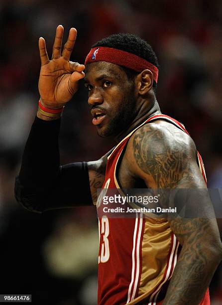 LeBron James of the Cleveland Cavaliers signals to teammates after making a three-point shot against the Chicago Bulls in Game Four of the Eastern...
