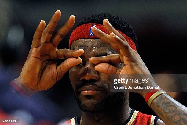 LeBron James of the Cleveland Cavaliers signals to teammates after making a three-point shot at the end of the 3rd quarter against the Chicago Bulls...