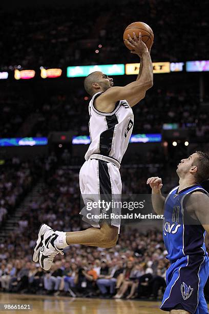 Guard Tony Parker of the San Antonio Spurs takes a shot against Jose Juan Barea of the Dallas Mavericks in Game Four of the Western Conference...