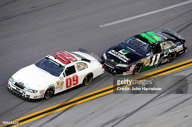 Patrick Sheltra, driver of the RAB Racing Ford, leads Brian Scott, driver of the AccuDoc Solutions Toyota, during the NASCAR Nationwide Series...
