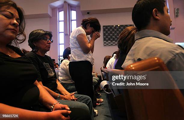 Opponents of Arizona's new immigration enforcement law pray at the First International Baptist Church on April 25, 2010 in Phoenix, Arizona. Hundreds...