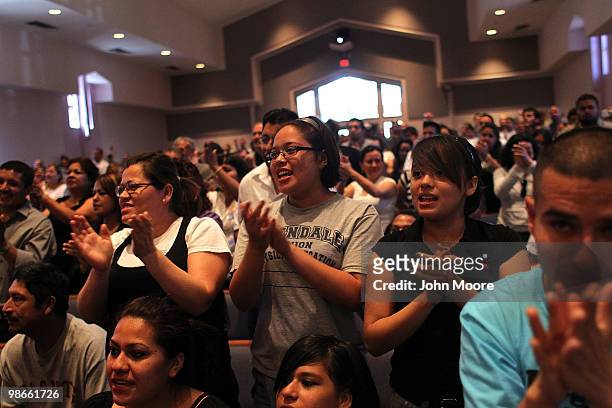 Opponents of Arizona's new immigration enforcement law cheer at a prayer serivce at the First International Baptist Church on April 25, 2010 in...