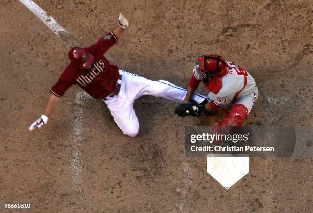 Catcher Carlos Ruiz of the Philadelphia Phillies tags out the sliding Stephen Drew of the Arizona Diamondbacks at home plate during the eighth inning...