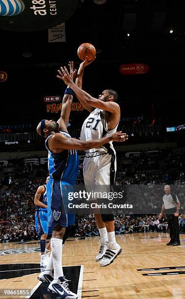 Tim Duncan of the San Antonio Spurs shoots over Erick Dampier of the Dallas Mavericks in Game Four of the Western Conference Quarterfinals during the...