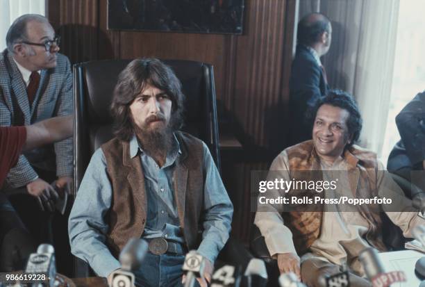 Former Beatle George Harrison pictured on left with Ravi Shankar at a press conference to promote their upcoming benefit show to aid of plight of...