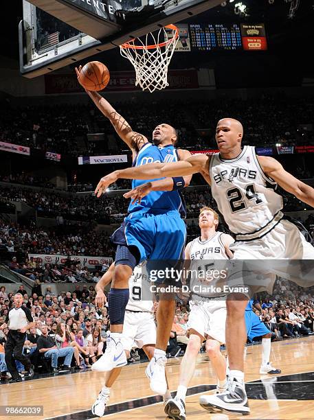 Shawn Marion of the Dallas Mavericks shoots against Richard Jefferson of the San Antonio Spurs in Game Four of the Western Conference Quarterfinals...