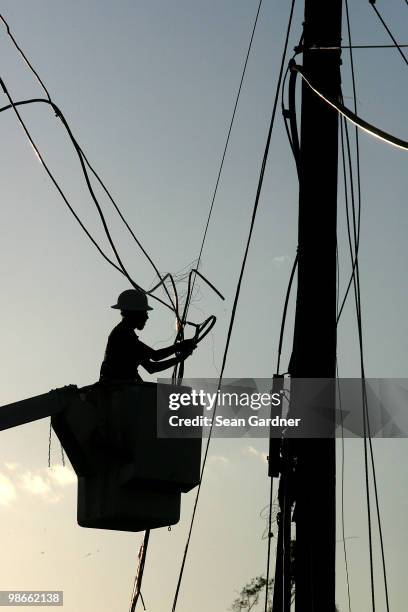 Electrical crews work late into the evening to restory power April 25, 2010 in Yazoo City, Mississippi. On Saturday a massive tonado hit the...