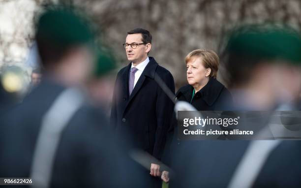 German Chancellor Angela Merkel of the Christian Democratic Union welcomes Polish Prime Minister Mateusz Morawiecki with military honours at the...